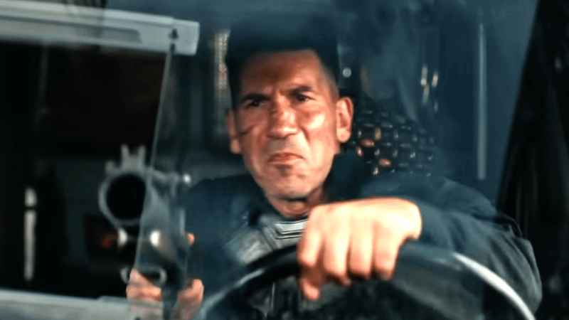 Jon Bernthal as the Punisher holding a gun through his window in 'Spider-Man: Brand New Day' trailer.