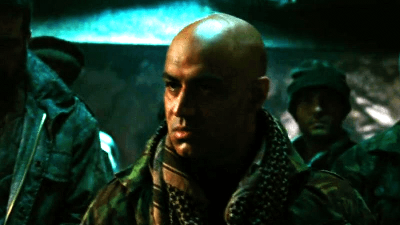 Faran Tahir as Raza looking angry in the desert in Iron Man
