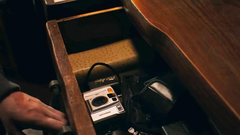 Bryan looting drawer in 2026 Resident Evil movie.
