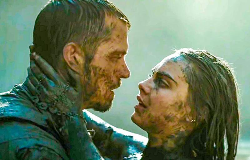 Joel Kinnaman and Cara Delevingne as Rick Flag and Dr. June Moone in Suicide Squad