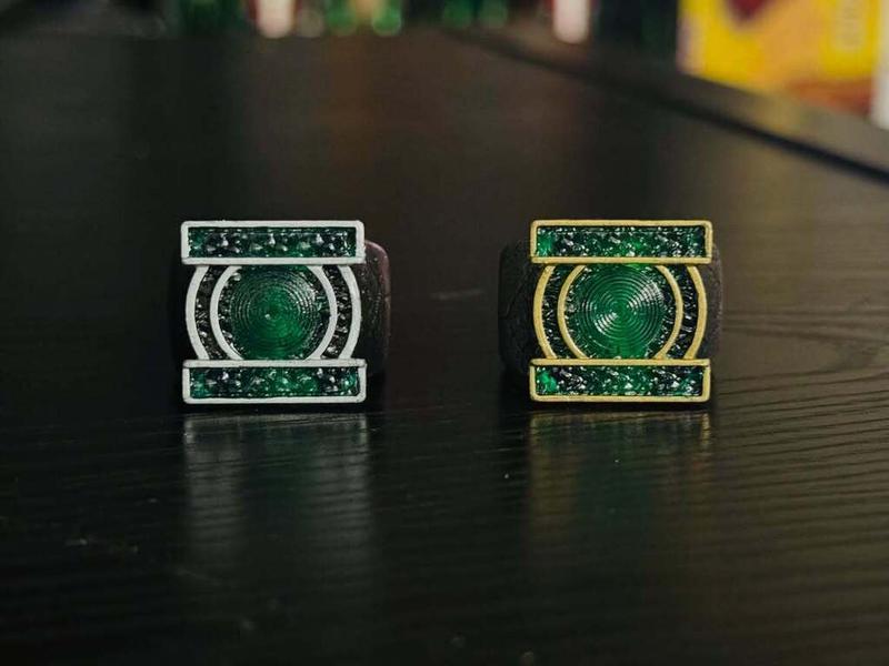A recreation of John Stewart's ring (left) and Hal Jordan's ring (right), not lit up.