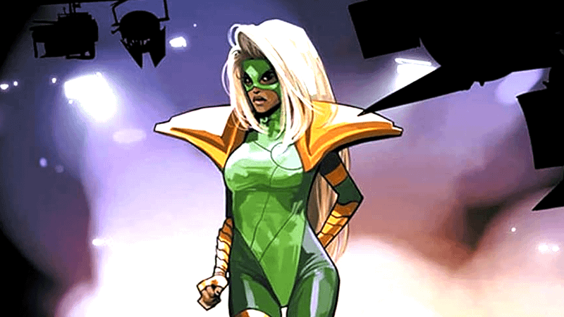 A green-suited character with blond hair and large golden shoulders on a stage in Saga