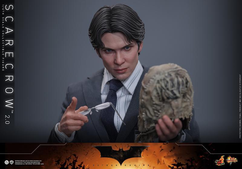 Dr. Jonathan Crane,holding his Scarecrow mask.