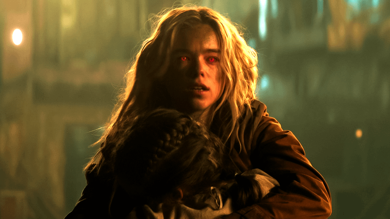 Milly Alcock as Kara Zor-El as her eyes glow red in Supergirl.