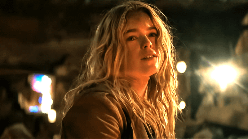 Milly Alcock as Supergirl looking sad in a tan jacket in Supergirl.