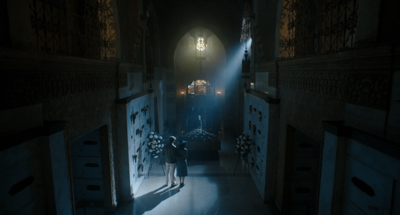 Flint Marko and Cat Hardy present for Silvermane's last rites in front of his coffin.