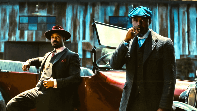 Michael B. Jordan as Smoke and Stack in Sinners.