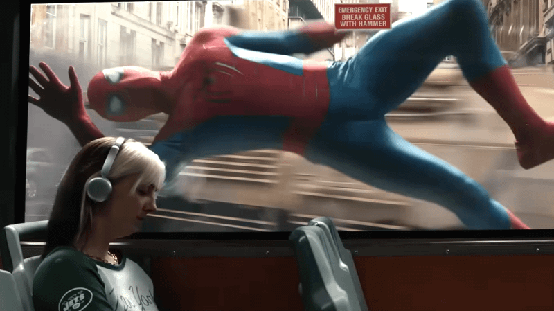 Image of Spider-Man from the Brazilian trailer against the bus window without his web-shooters.