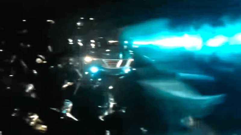 A ship blasting blue lasers.
