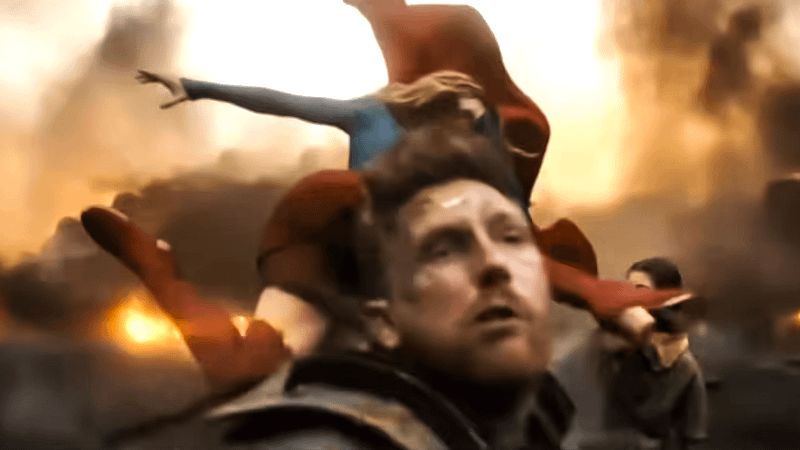 Supergirl kicking someone in the face.