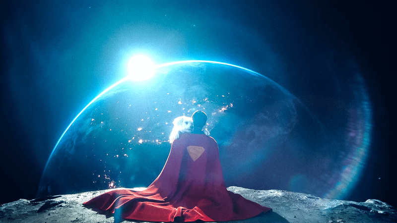 Superman and Krypto sitting on the moon in 'Superman.'