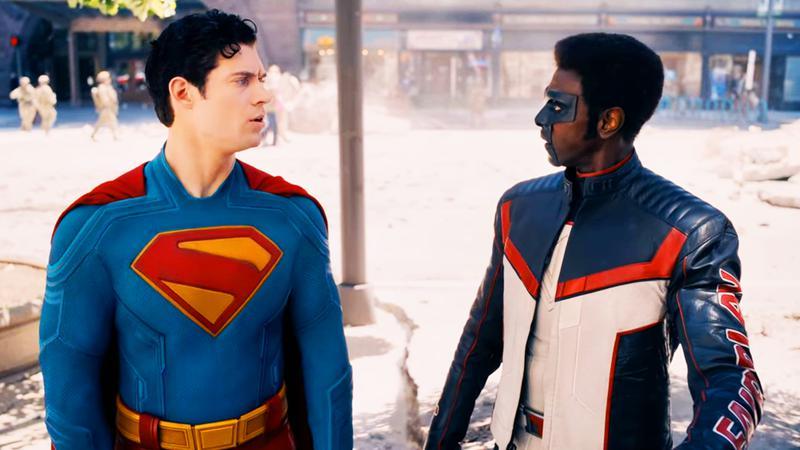 David Corenswet as Superman and Edi Gathegi as Mister Terrific conversing on a city street in Superman