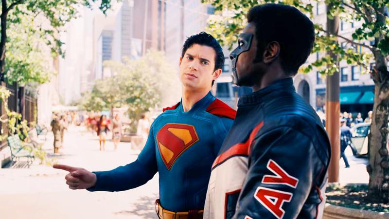 David Corenswet as Superman pointing at a wall in Superman