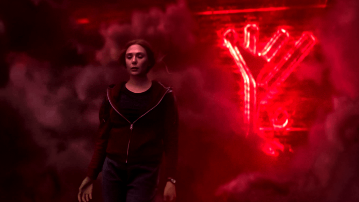 Wanda Maximoff standing in front of a red rune.