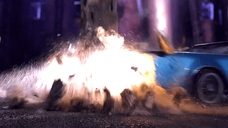 Blue car smashing into concrete pillar