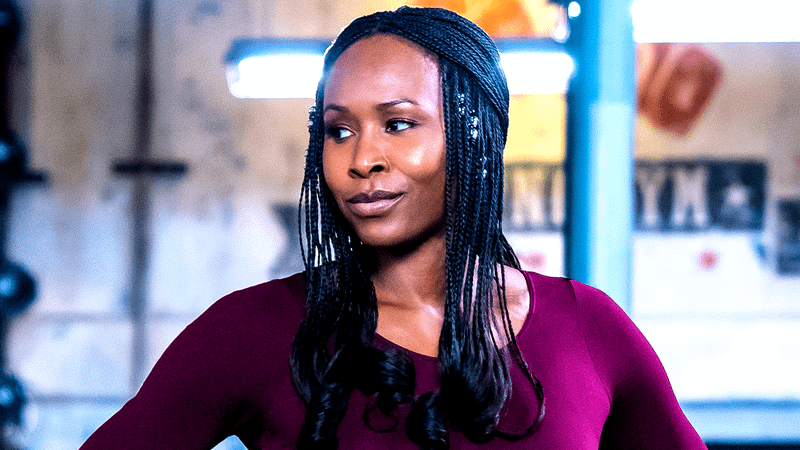 Sydelle Noel wearing a red shirt