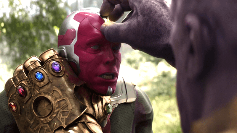 Thanos pulling the Mind Stone from Vision's head in 