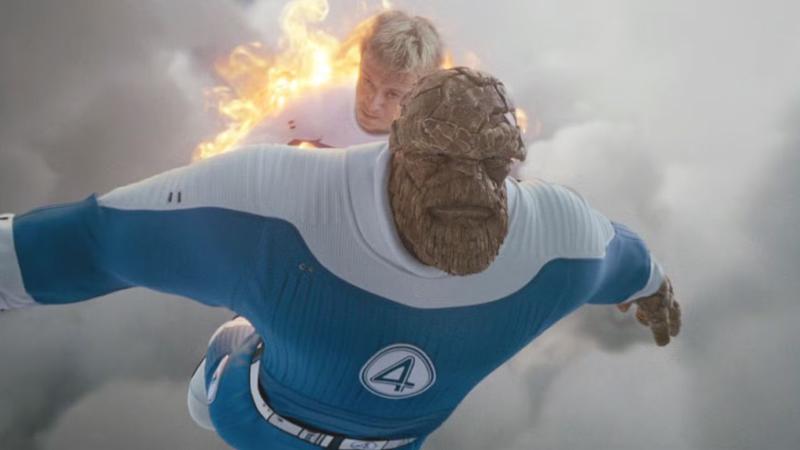 Human Torch holding The Thing in Fantastic Four: First Steps.