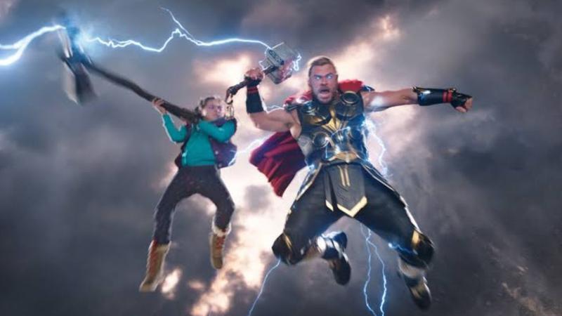 Love and Thor wielding weapons in Thor: Love and Thunder.