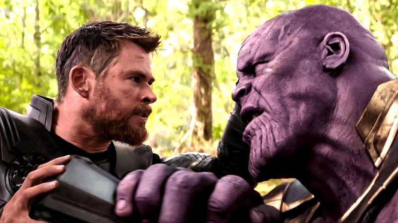 Thor buries Stormbreaker into Thanos' chest.