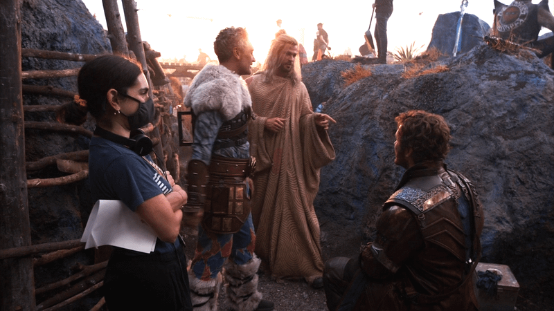 A Marvel Studios: Assembled set photo featuring Chris Hemsworth, Taika Waititi, and Chris Pratt on the set of Thor: Love and Thunder.