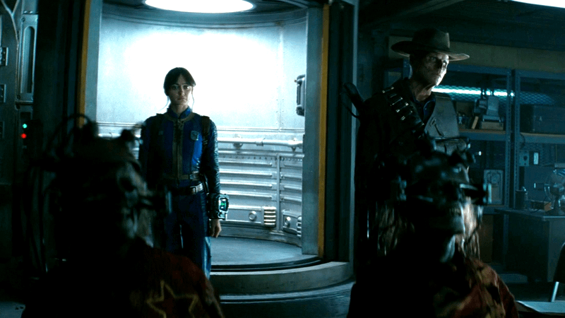 Ella Purnell as Lucy next to Walton Goggins as Ghoul standing in Vault 24 in Fallout