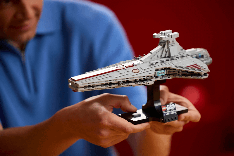 Someone holding the Venator cruiser LEGO set