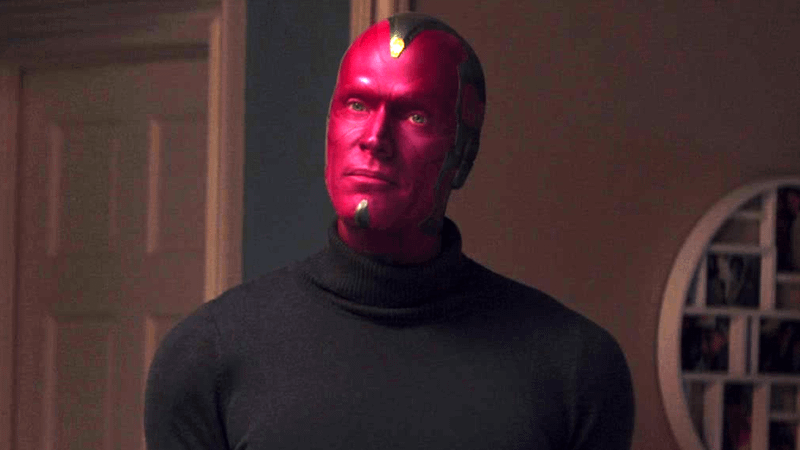 Paul Bettany as Vision standing in a turtle-neck top in WandaVision