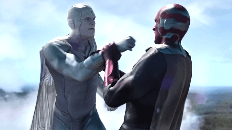 White Vision and Red Vision battle each other.