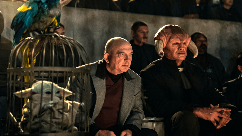 Grogu and crowd in 'The Mandalorian and Grogu.'