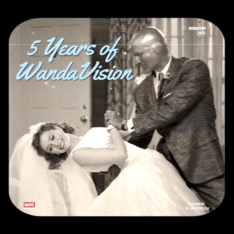 Vision dips Wanda Maximoff as they share a dance in their wedding attire in the opening of WandaVision.