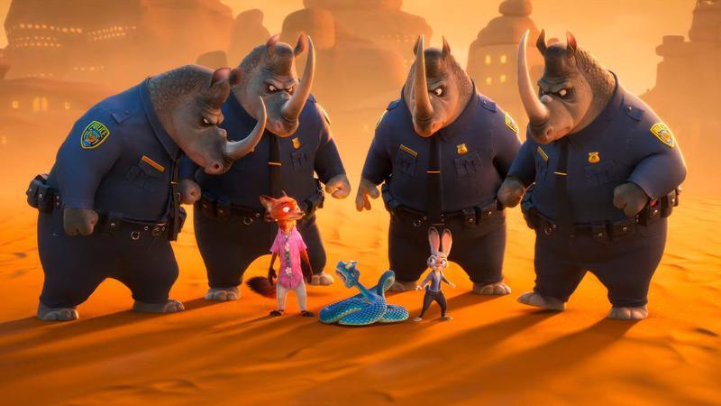 Nick, Gary, and Judy surrounded by rhinos